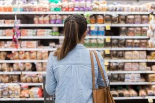 Woman looking at grocery items on a shelf