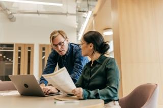 business meeting between two people in office