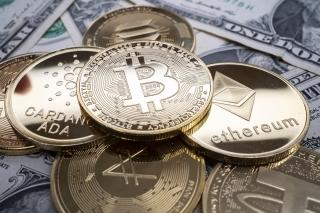 A selection of different cryptocurrency coins piled together over US dollar