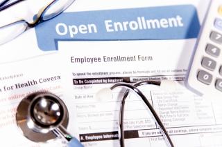 Healthcare benefit forms including: enrollment forms and applications, stethoscope, calculator