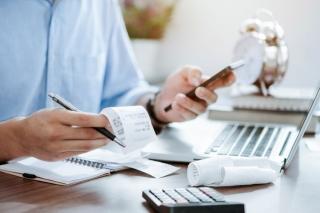 Business man paying bills