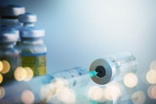 Hypodermic needle in a vial stock photo used by Woodruff Sawyer.