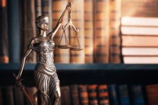 justice statue book shelf