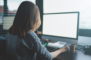 woman sitting at computer