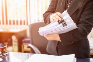 Business woman filing paperwork