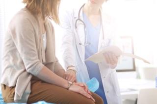 Doctor consulting patient regarding long COVID