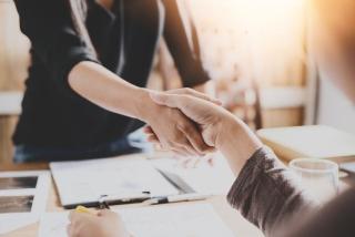 Handshake over business contracts