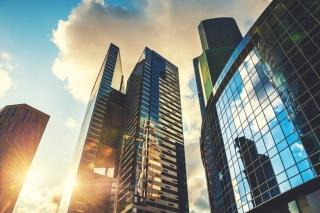 Modern glass skyscrapers at sunset