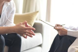 Patient consulting with therapist