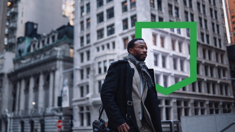 A businessman in a suit striding confidently on a bustling city street