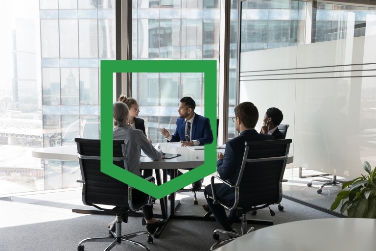 Group gathered in office holding a meeting