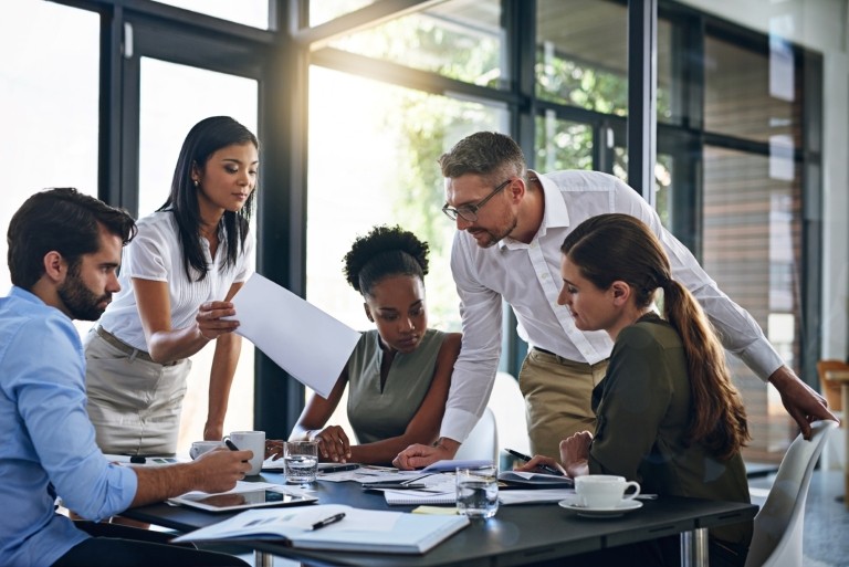 A team going over paperwork in office