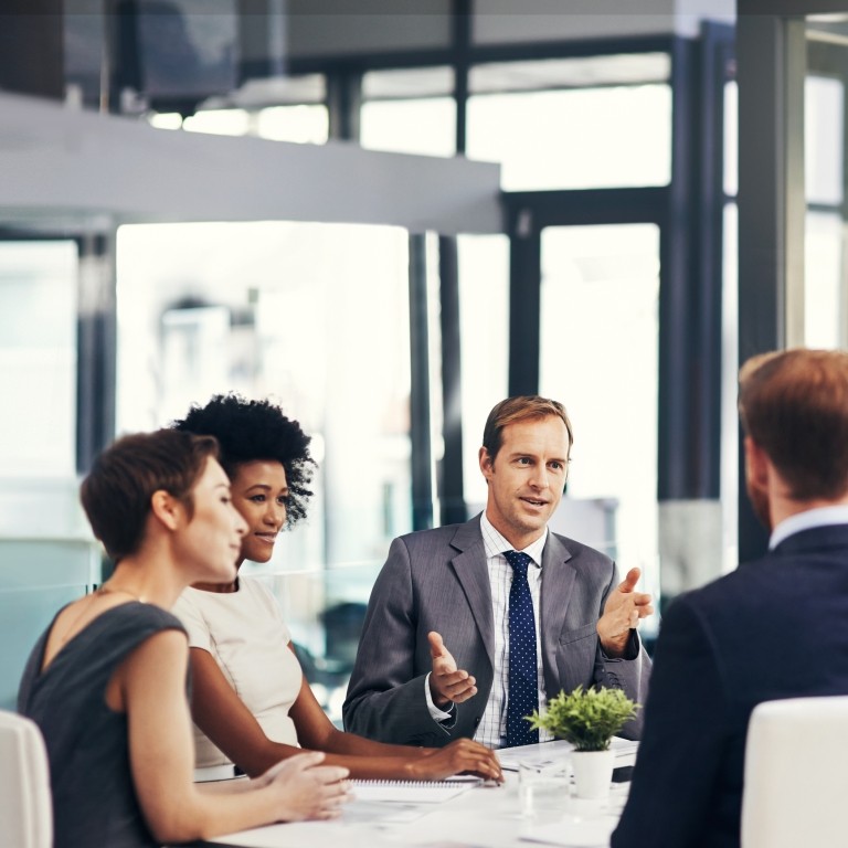 group of businesspeople having a meeting in the boardroom