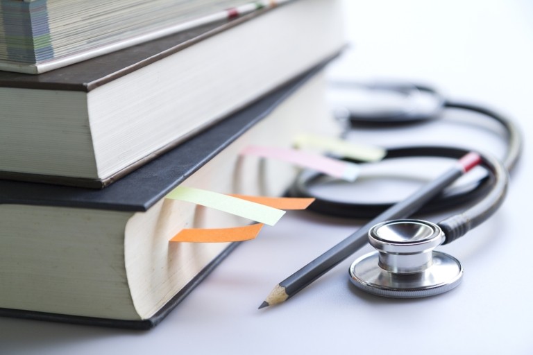 Stack of medical student textbooks