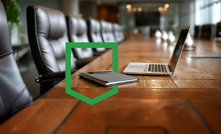 board room with notebook and laptop