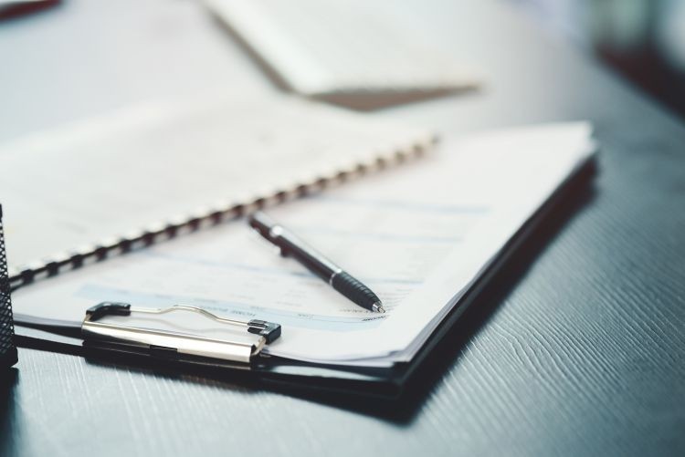 Notebook and pen on a desk