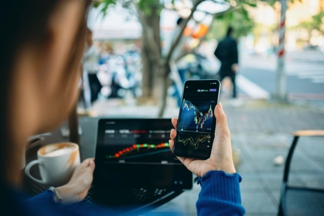 image of person looking at stock market