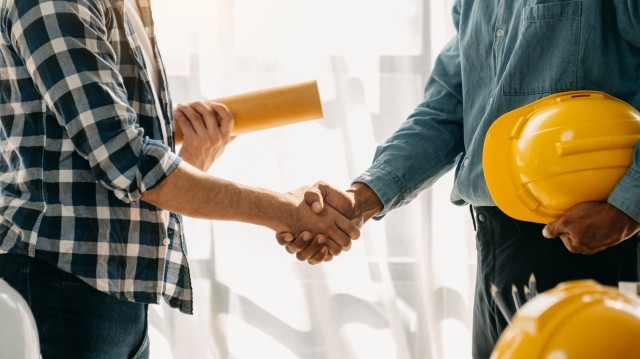 construction contractors shaking hands