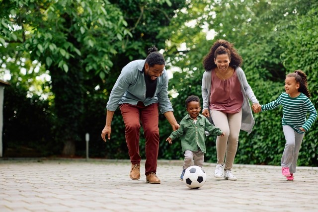 family playing soccer