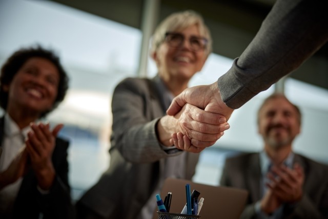 people shaking hands, office people celebrating