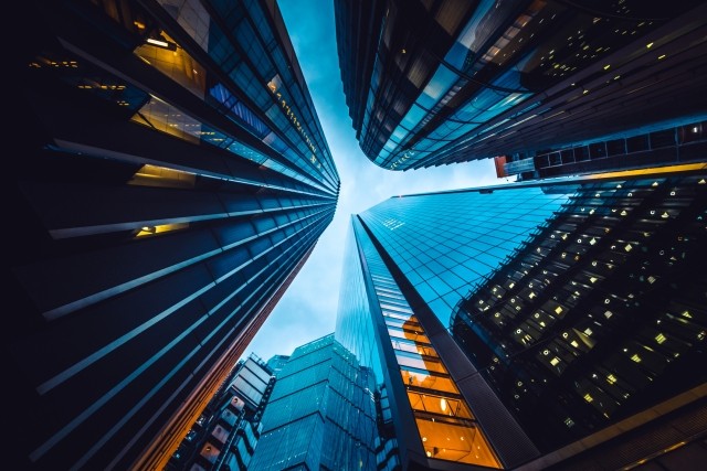 Looking up at buildings, twilight sky