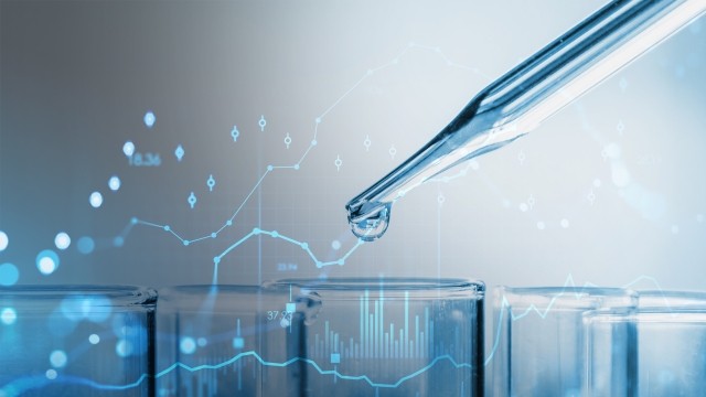 pipette dropping a solution into test tubes, overlayed with data charts