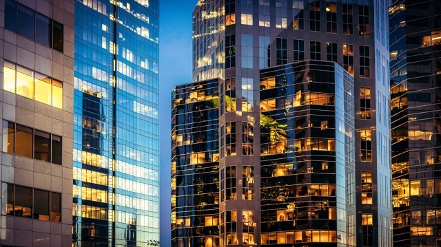 buildings with some lights turned on, dusk