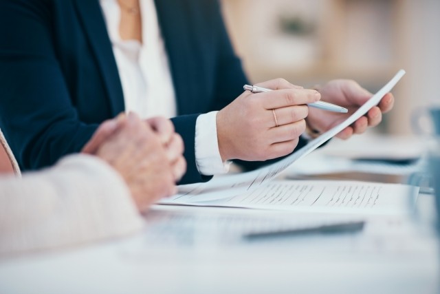 people looking at law paperwork