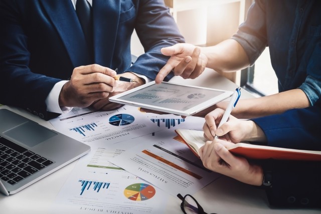 business team looking over stocks