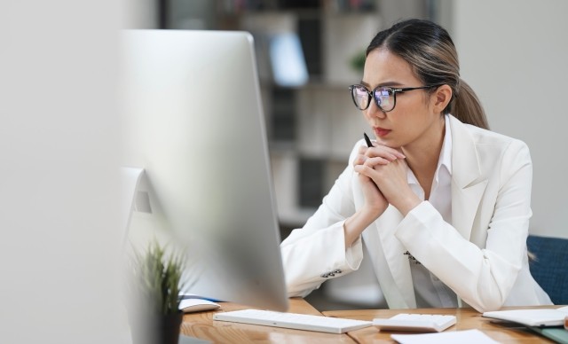 women working with monitor