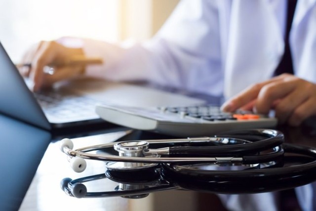 medical billing stethoscope calculator laptop