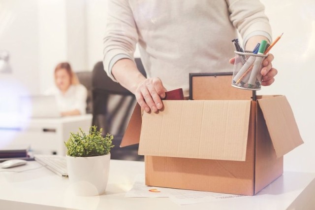 Employee packing up boxes due to employment termination