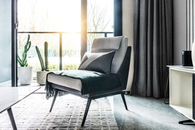 Sun shining through living room window of residential home