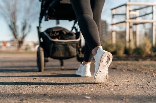 Person jogs while pushing baby stroller