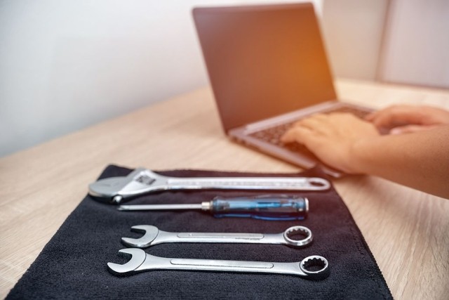 tools laid out next to a laptop