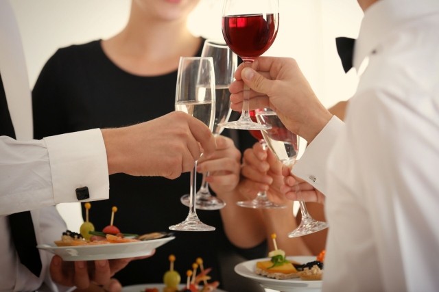 Image of employees drinking wine at a reception