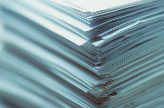 An image of a stack of white papers.