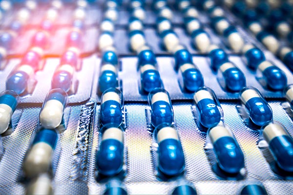 Close-up image of blue and white prescription pills