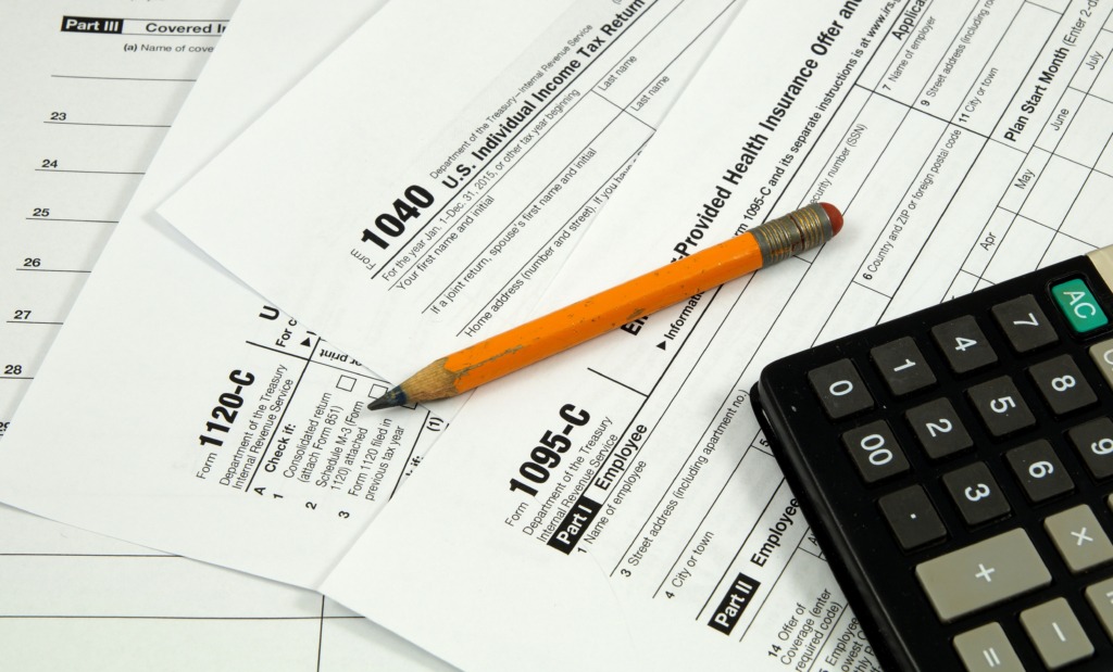 Image of tax forms, including the 1095-C
