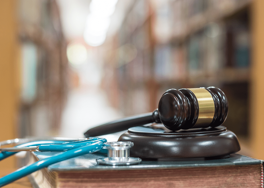 image of gavel and stethoscope with books