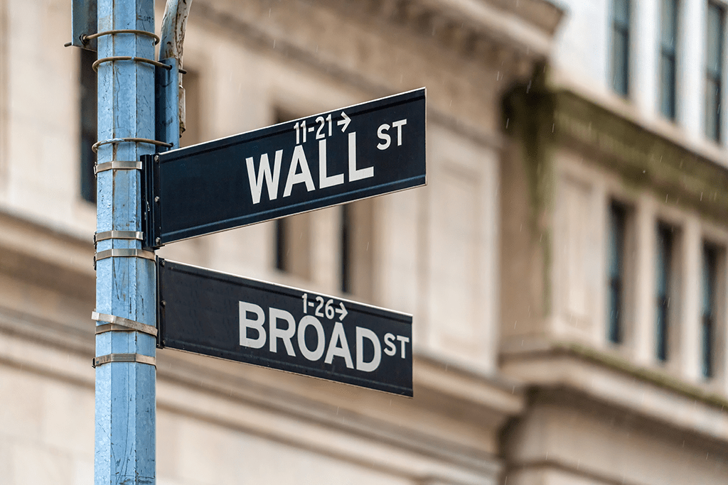 image of the street signs for broad street and wall street