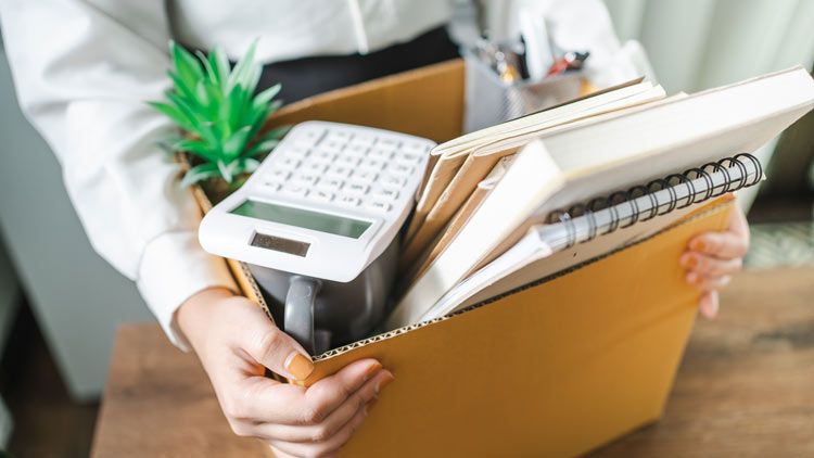 Employee resigning and packing office supplies